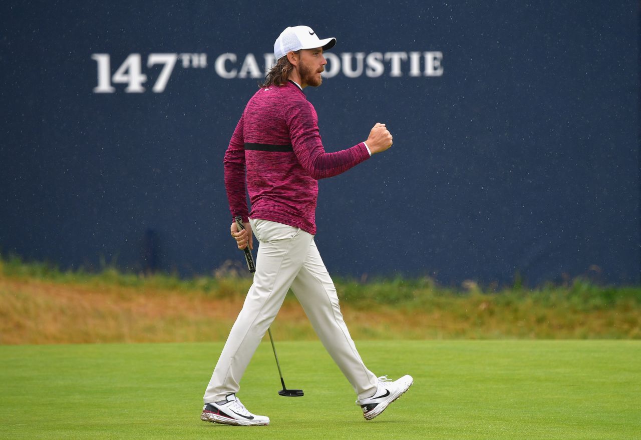 Tommy Fleetwood pumps his fist after a birdie on No. 18 on Friday. He finished with a 65.