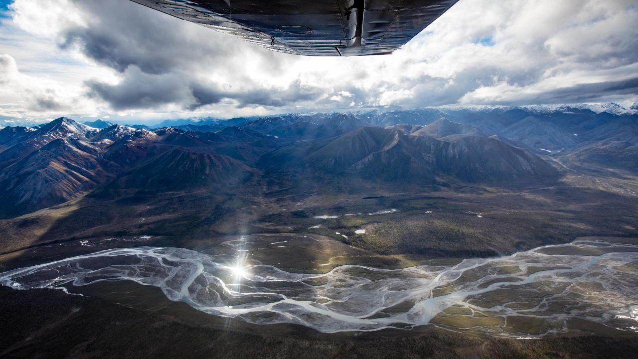 The vast wilderness of the Arctic National Wildlife Reserve towards the Brooks Range seen from the air.