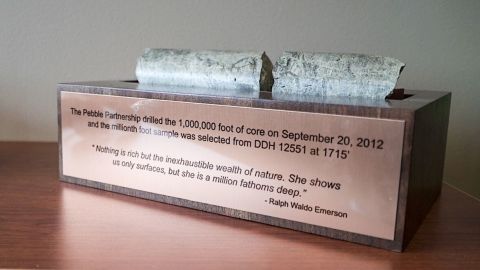A core sample from the proposed Pebble Mine is mounted above a quote from Ralph Waldo Emerson, a defender of the natural world.