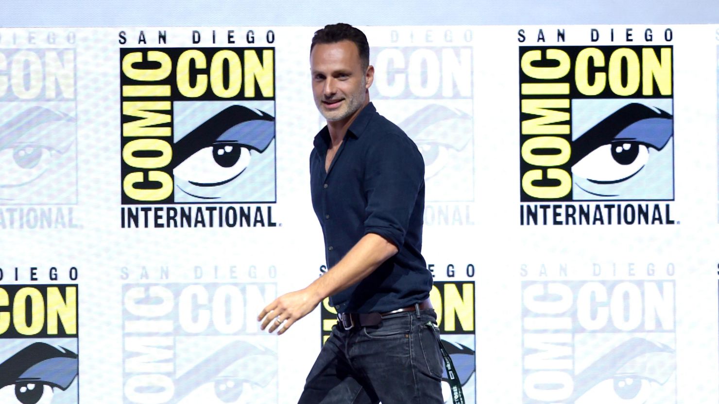 Andrew Lincoln walks onstage at AMC's "The Walking Dead" panel during Comic-Con International 2018 on Friday