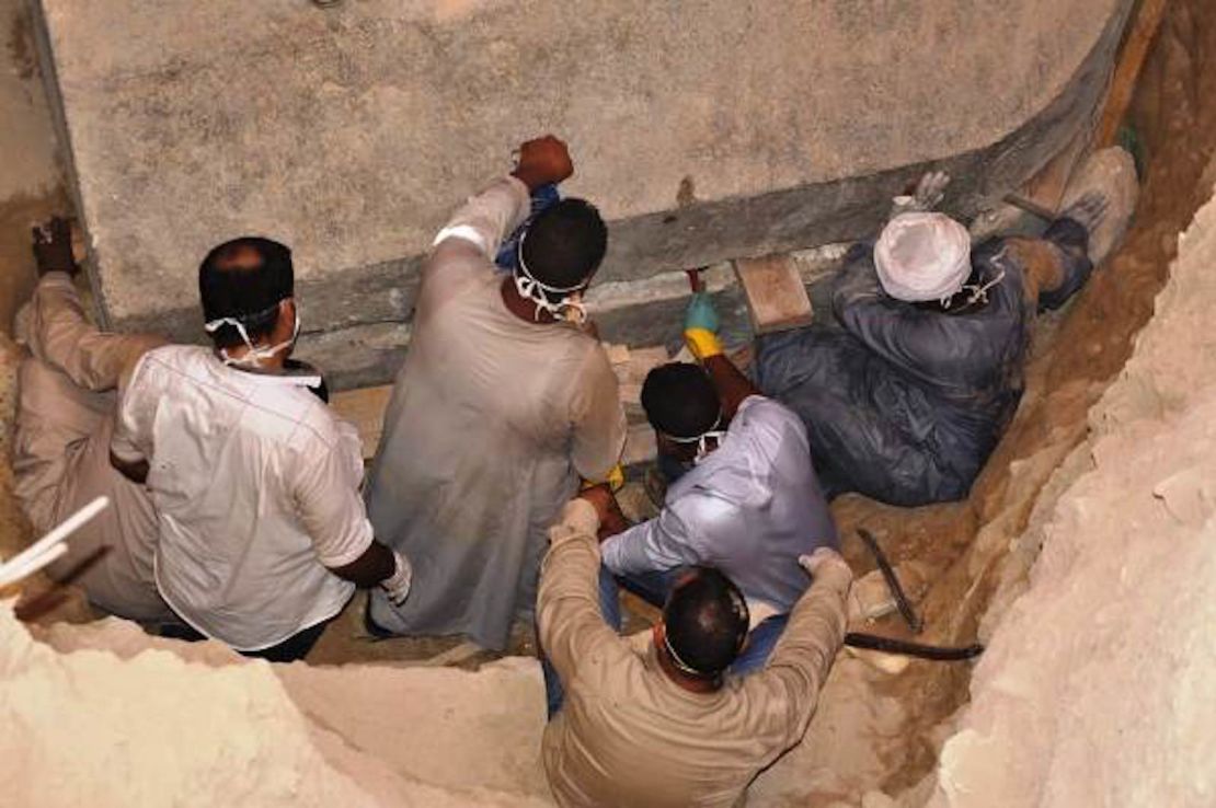 Pictures from the Egyptian Ministry of Antiquities of the archaeologists opening the sarcophagus lid.