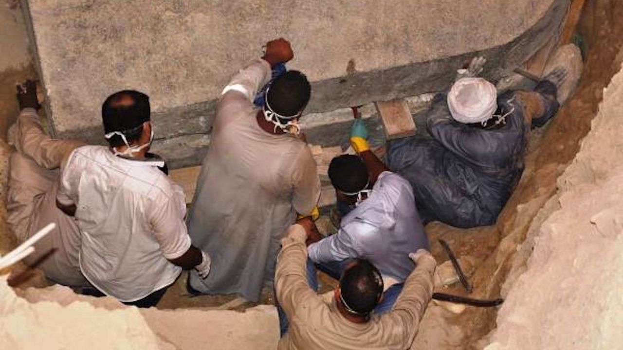 Pictures from the Egyptian Ministry of Antiquities of the archaeologists opening the sarcophagus lid.