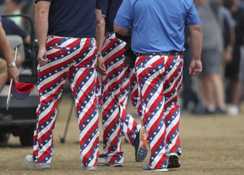 Fans don USA-themed trousers on the third day of the Open.
