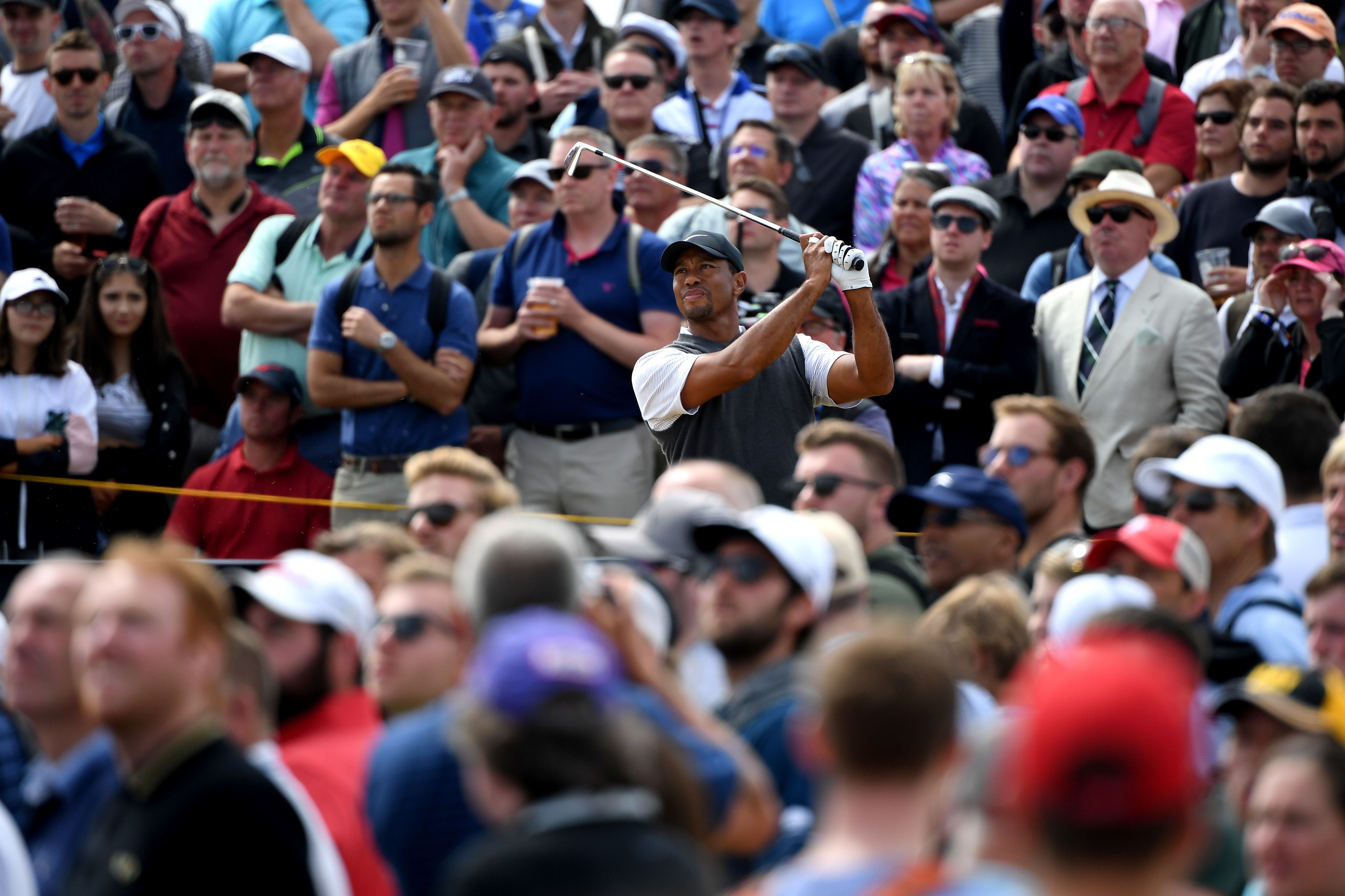 Woods tees off on the fifth hole Saturday.
