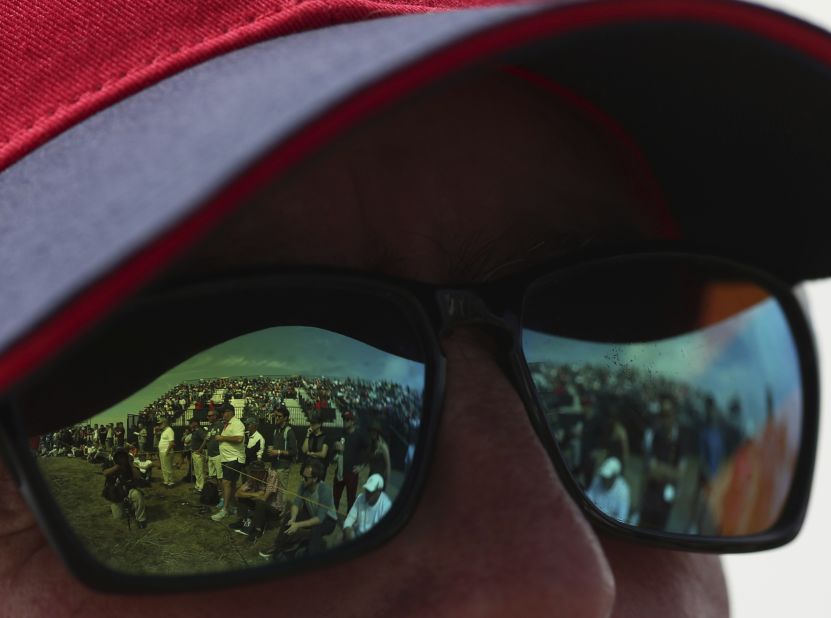 Fans are reflected in sunglasses on Saturday.