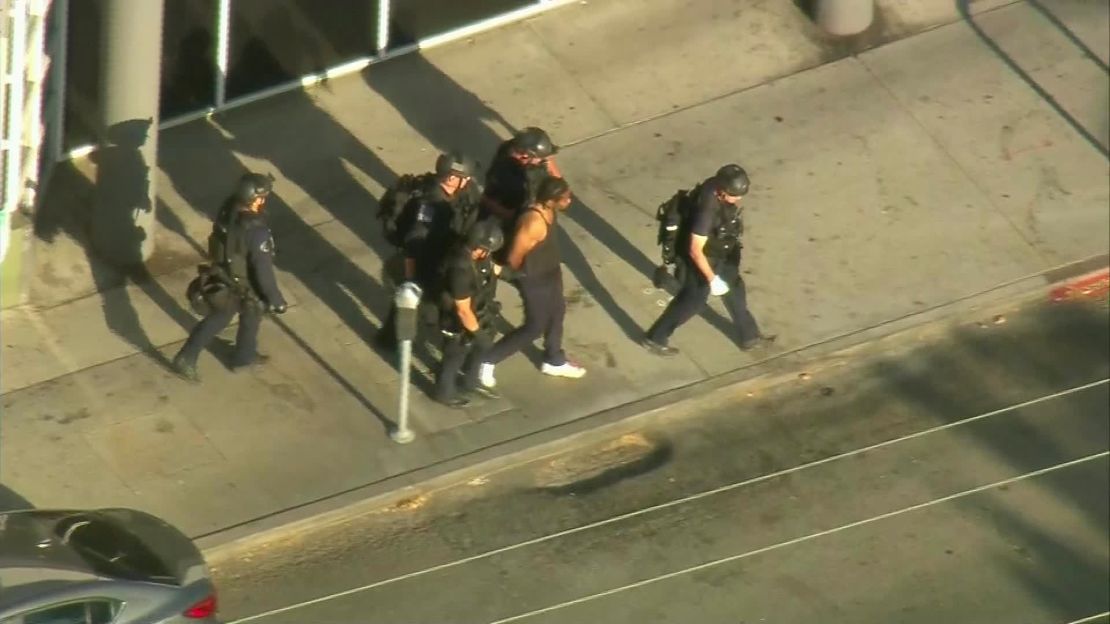 Aerial footage showed police leading the suspect away in handcuffs.