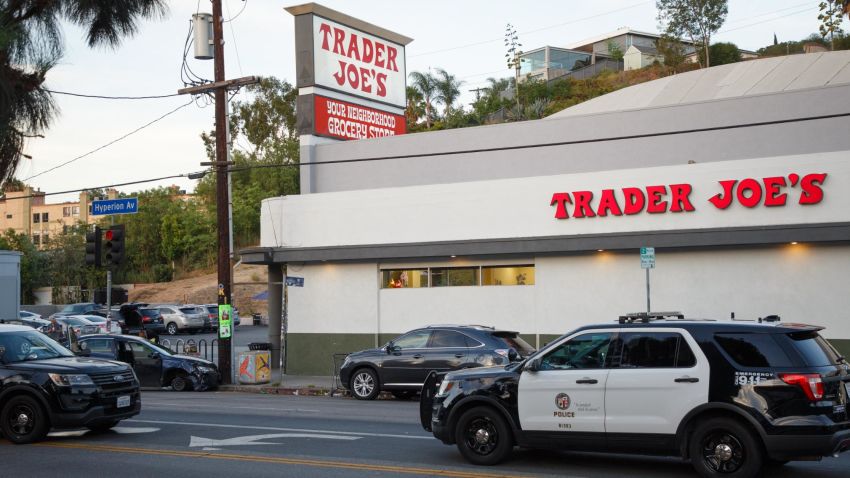 epa06903638 Police investigate the aftermath of a hostage situation at the Trader Joes grocery store in the Silver Lake neighborhood of Los Angeles, California, USA, 21 July 2018. A gunman crashed his car into the utility pole outside the store before surrendering to authorities. One person was killed in the store during a gun battle with police that started earlier in the day with a domestic dispute.  EPA/EUGENE GARCIA