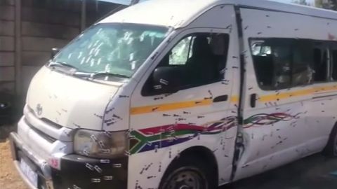 The assailants who shot up a South African taxi bus remain at large.