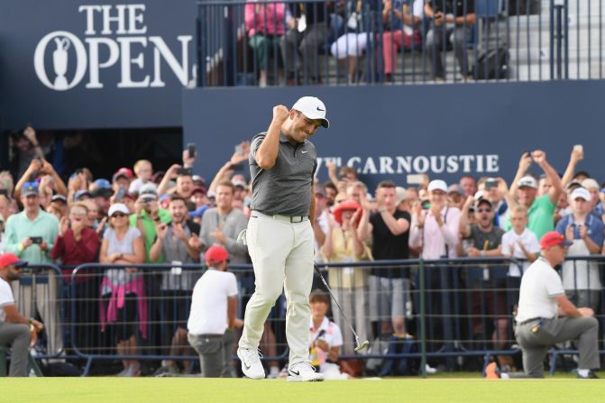 Francesco Molinari celebrates after sinking a putt on the last hole of the British Open on Sunday, July 22. <a href="index.php?page=&url=http%3A%2F%2Fwww.cnn.com%2F2018%2F07%2F22%2Fsport%2Fbritish-open-carnoustie-final-round-golf-spt-intl%2Findex.html" target="_blank">He won by two strokes</a> for his first career major.