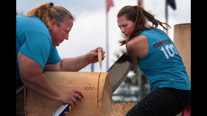 With help from Nancy Zalewski, Kendal Kunelius competes at the Lumberjack World Championships on Thursday, July 19. The competition took place in Hayward, Wisconsin.