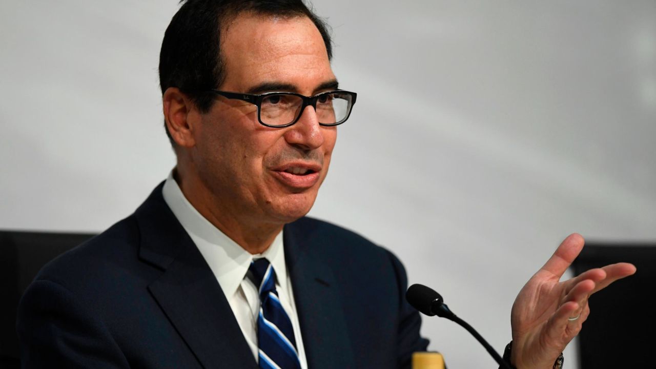US Secretary of the Treasury Steven Mnuchin, gestures during a press conference in Buenos Aires, on July 22, 2018, at the end of the G20 Finance Ministers and Central Bank Governors meeting. - Group of 20 finance ministers warned on Sunday that "heightened trade and geopolitical tensions" posed risks to global economic growth as two days of meetings came to a close. (Photo by EITAN ABRAMOVICH / AFP)        