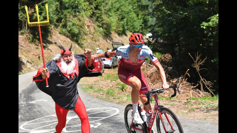 Nils Politt passes an exuberant fan during the 11th stage of the Tour de France on Wednesday, July 18.