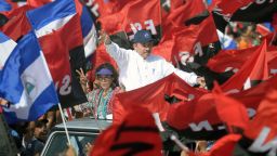Nicaraguan President Daniel Ortega (R) and his wife, Vice President Rosario Murillo (L), wave to supporters during the commemoration of the 39th Anniversary of the Sandinista Revolution at "La Fe" square in Managua on July 19, 2018. - Nicaragua's President Daniel Ortega on Thursday marked the 39th anniversary of the Sandinista revolution's victory that first brought him to power after intensifying a deadly crackdown on protesters demanding he step down. (Photo by MARVIN RECINOS / AFP)        (Photo credit should read MARVIN RECINOS/AFP/Getty Images)