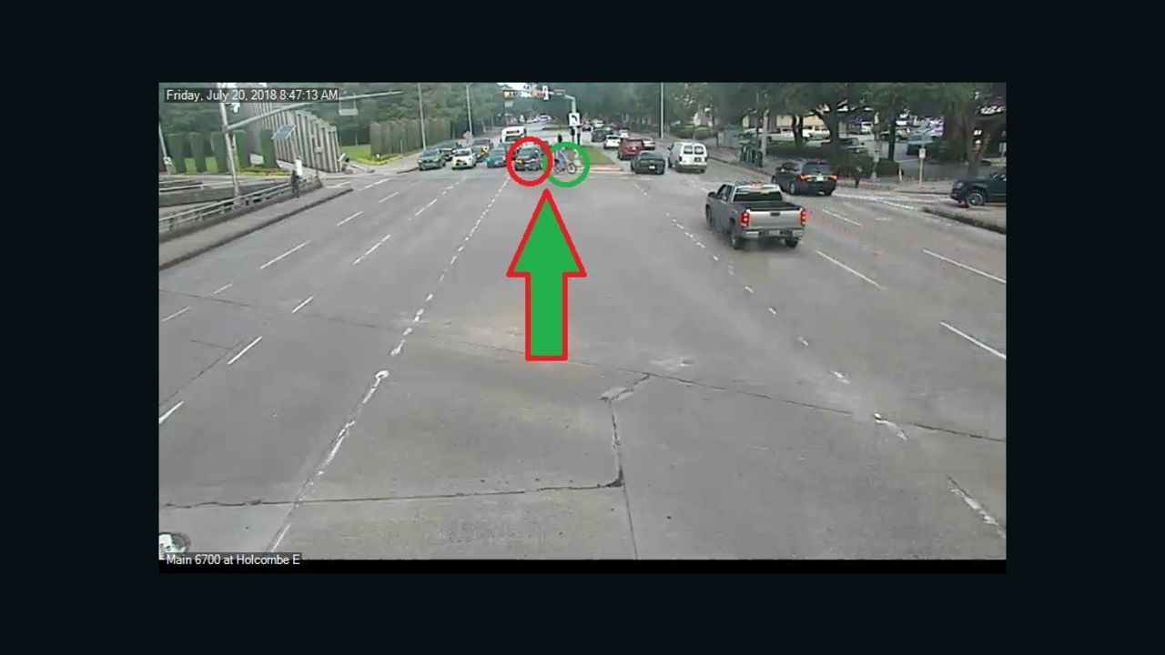 The suspect, circled in red, nears Hasknecht on the road.