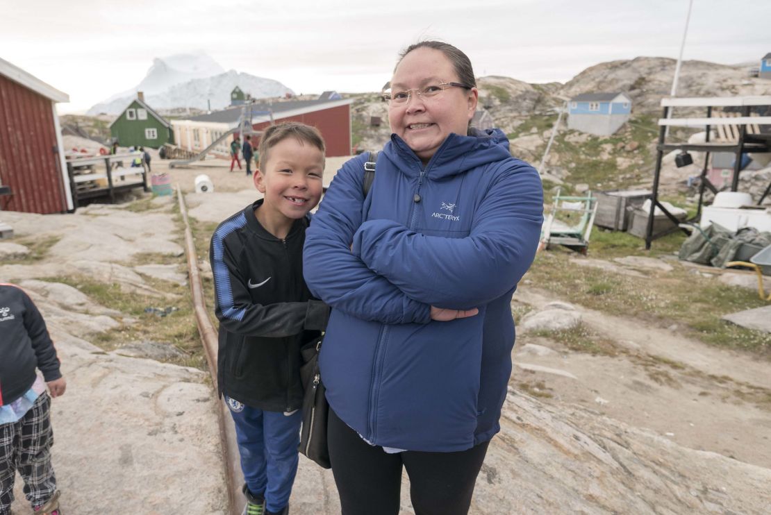 Schoolteacher Pia Kristensen -- seen with her son Unu -- believes icebergs could end up drawing tourists.