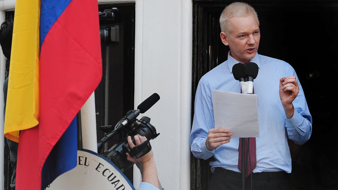 Assange addresses the media and his supporters from the balcony of the Ecuadorian Embassy in London on August 19, 2012. A few days earlier, Ecuador announced that it had granted asylum to Assange. In his public address, Assange demanded that the United States drop its "witch hunt" against WikiLeaks.