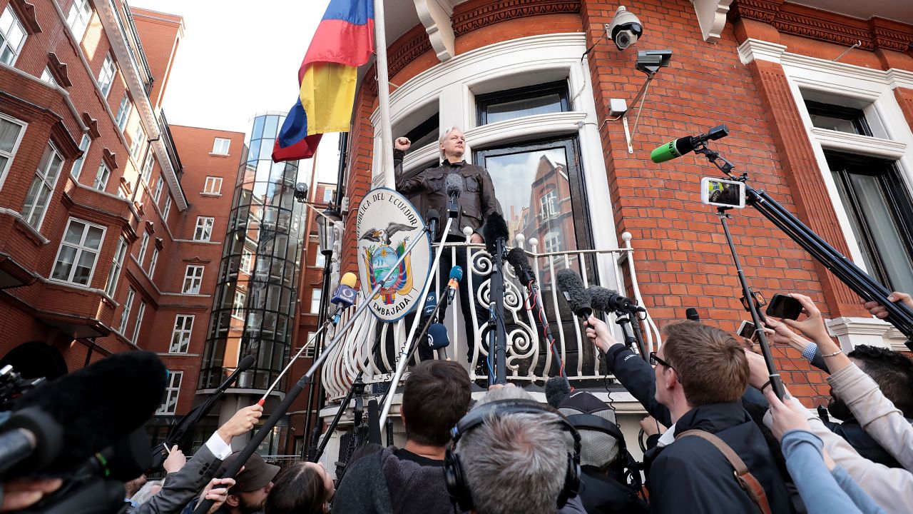 Assange speaks to the media from the balcony of the embassy in May last year. 