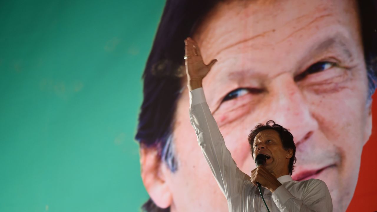 Pakistani cricket star-turned-politician and head of the Pakistan Tehreek-e-Insaf (PTI) Imran Khan gestures as he delivers a speech during a political campaign rally, in Islamabad, on July 21, 2018.
