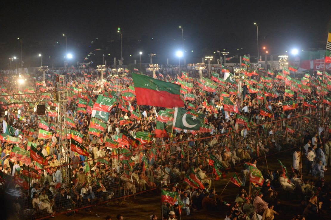 Supporters of Pakistani cricketer turned politician Imran Khan of the Pakistan Tehreek-e-Insaf (Movement for Justice), cheer as they attend an election campaign rally by Khan's ahead of the general election in Karachi on July 22, 2018.