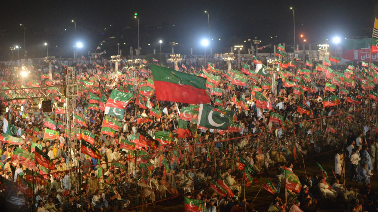 Supporters of Pakistani cricketer turned politician Imran Khan of the Pakistan Tehreek-e-Insaf (Movement for Justice), cheer as they attend an election campaign rally by Khan's ahead of the general election in Karachi on July 22, 2018.