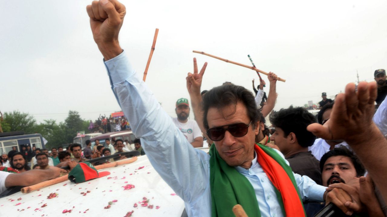 Pakistani cricketer-turned-politician Imran Khan gestures as he leads a protest march to Islamabad against the country's Pakistan Muslim League-Nawaz-led government in Wazirabad in eastern Punjab province on August 15, 2014.