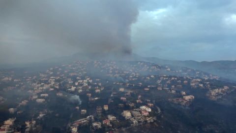 This handout picture released by the Ministry of Defence on Tuesday shows an aerial view of the fire in Mati.
