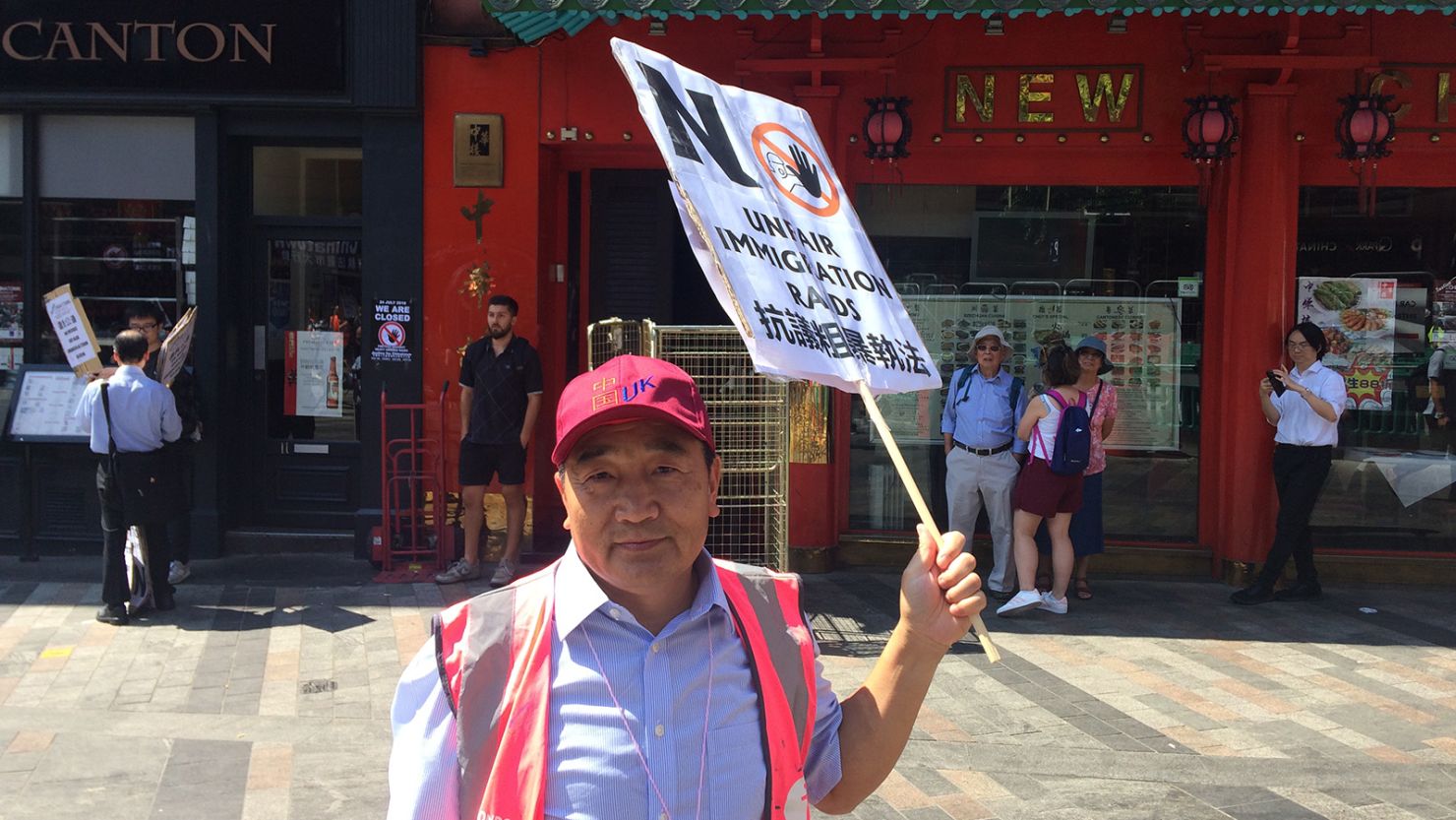 Peter Ren, owner of the New China restaurant, attends a protest in London's Chinatown on Tuesday.