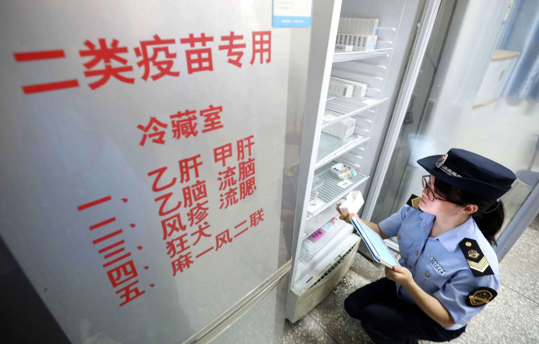 A local market supervisory authority official checks on vaccines at a hospital in Rongan in China's southern Guangxi region on July 23, 2018.