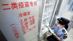 A local market supervisory authority official checks on vaccines at a hospital in Rongan in China's southern Guangxi region on July 23, 2018. - Chinese Premier Li Keqiang has vowed stern action over the latest safety scare to hit the country's pharmaceutical industry, as a mounting scandal over a rabies vaccine sent drug stocks tumbling. (Photo by - / AFP) / China OUT / The erroneous mention[s] appearing in the metadata of this photo by - has been modified in AFP systems in the following manner: [local market supervisory authority official] instead of [Food and Drug Administration officer]. Please immediately remove the erroneous mention[s] from all your online services and delete it (them) from your servers. If you have been authorized by AFP to distribute it (them) to third parties, please ensure that the same actions are carried out by them. Failure to promptly comply with these instructions will entail liability on your part for any continued or post notification usage. Therefore we thank you very much for all your attention and prompt action. We are sorry for the inconvenience this notification may cause and remain at your disposal for any further information you may require.        (Photo credit should read -/AFP/Getty Images)