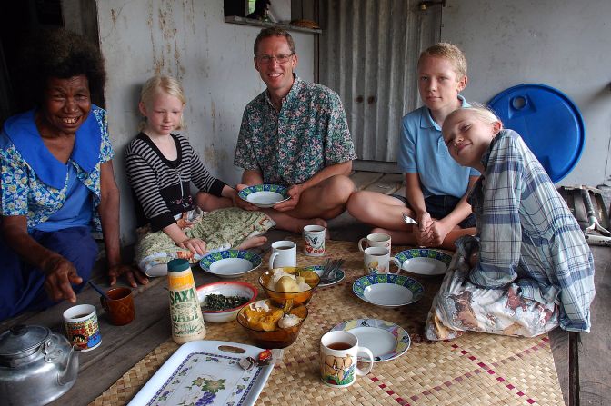 The family -- seen taking in a home-cooked meal in Papua New Guinea -- has enjoyed experiencing other cultures through their cuisines and learning recipes. 