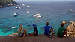 The Giffrord family looks out onto the Andaman Sea in the Indian Ocean.