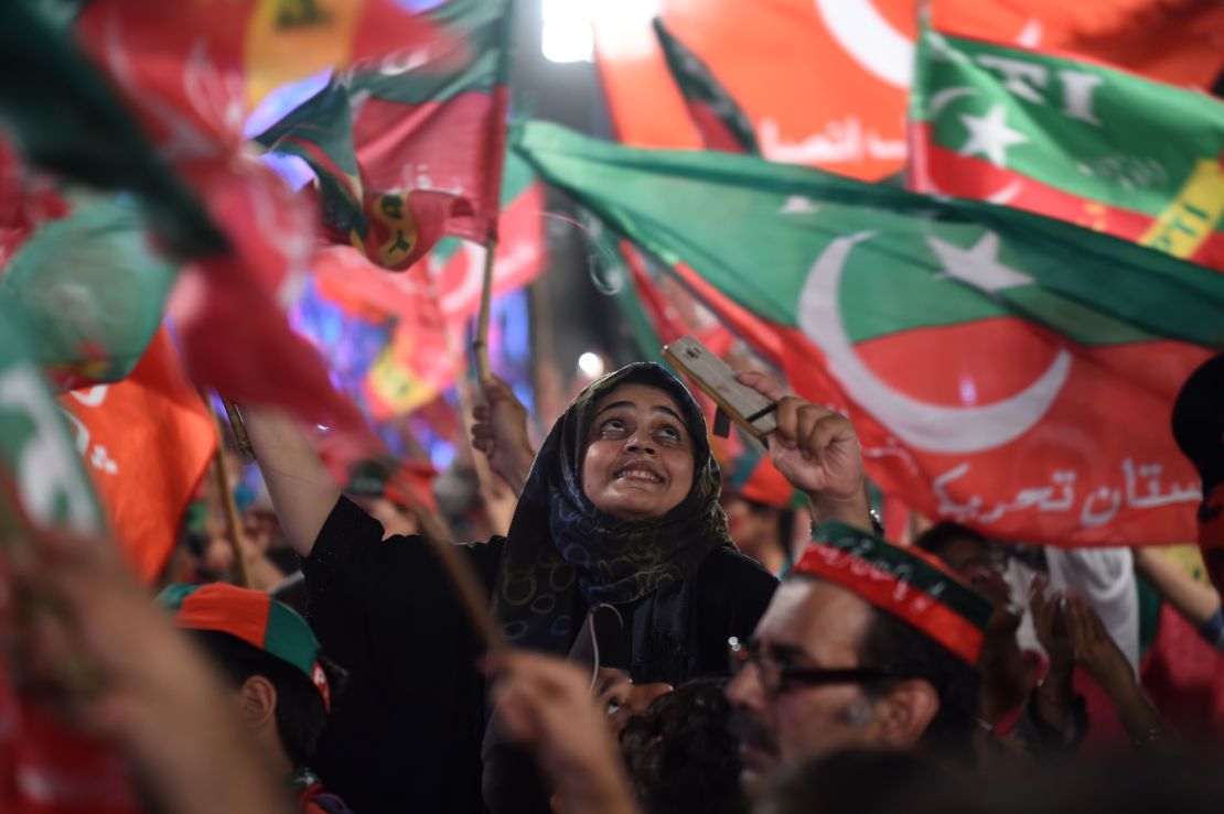 Supporters of Imran Khan cheer at a rally in Lahore on July 23, 2018.