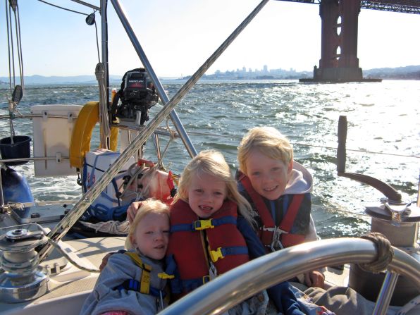 With life jackets firmly secured, the Gifford siblings sailed through San Francisco at the start of their journey: four-year-old Siobhan (left), six-year-old Mairen (middle) and nine-year-old Niall (right) could not swim at the time, though they would soon take to the water like fish. 