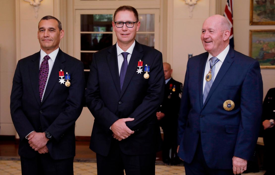 Australian members of the Thai cave rescue team, Craig Challen, left, and Dr. Richard Harris, center, at a function at Government House in Canberra, Australia on July 24.