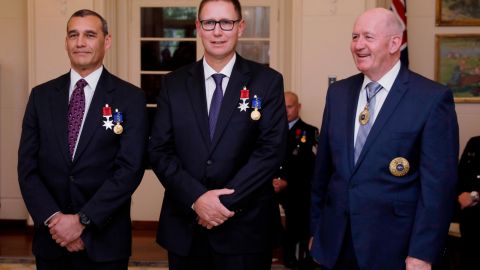 Australian members of the Thai cave rescue team, Craig Challen, left, and Dr. Richard Harris, center, at a function at Government House in Canberra, Australia on July 24.