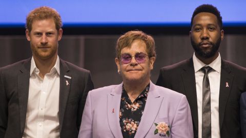 Sir Elton John (m), Harry, Duke of of Sussex (l) and Nelson Mandela's grandson Ndaba Mandela (r), on stage together during the International AIDS Conference in Amsterdam.