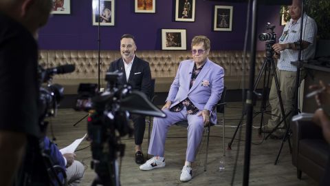 "We were profoundly affected by the people we lost," said David Furnish, left, John's husband.