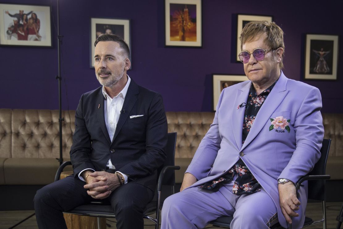 Elton John and his husband, David Furnish, speak with CNN at the International AIDS Conference in Amsterdam.
