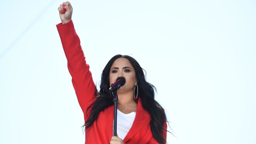 Singer Demi Lovato sings at the March for Our Lives rally in Washington, DC on March 24, 2018. Galvanized by a massacre at a Florida high school, hundreds of thousands took to the streets in cities across the United States on Saturday in the biggest protest for gun control in a generation. / AFP PHOTO / JIM WATSON        (Photo credit should read JIM WATSON/AFP/Getty Images)