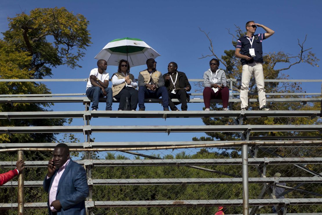 Elections observers from the European Union and the African Union sit on bleachers as leading opposition challenger Nelson Chamisa addresses a campaign rally in Bulawayo.