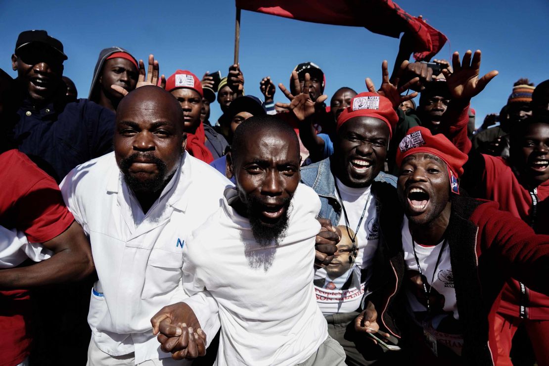 Movement for Democratic Change supporters cheer as they gather to listen to their leader Nelson Chamisa.