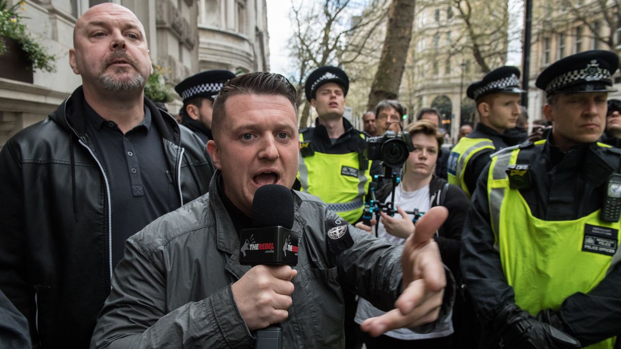 Former EDL leader Tommy Robinson is escorted by police during a protest titled 'London march against terrorism' in April 2018.