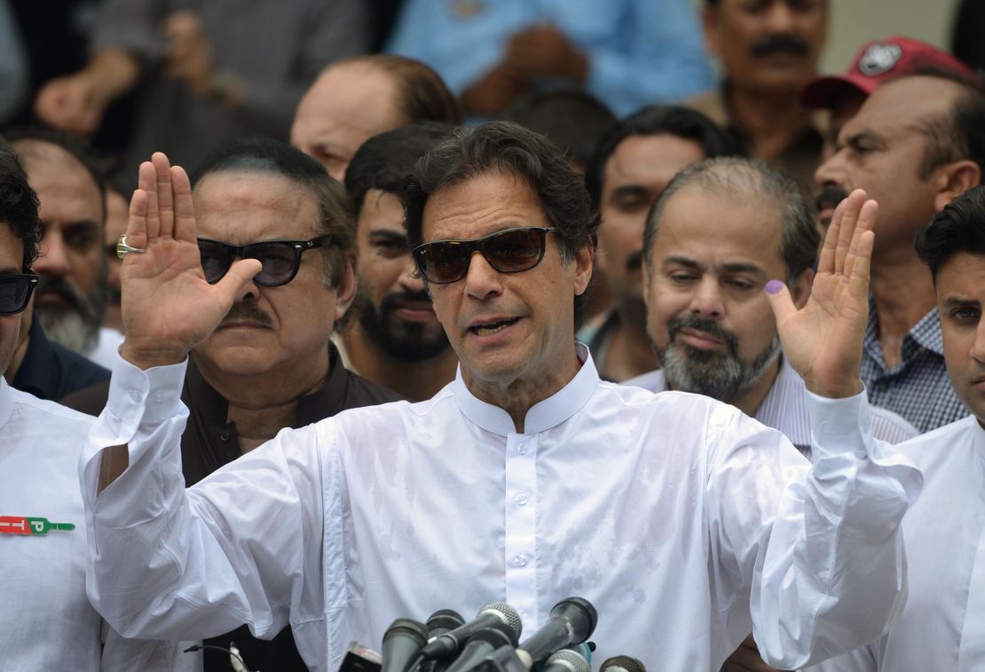 Imran Khan speaks to the media after casting his vote in Islamabad on Wednesday.