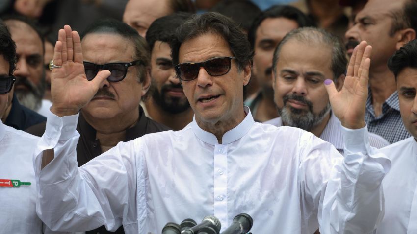 Pakistan's cricketer-turned politician Imran Khan of the Pakistan Tehreek-e-Insaf (Movement for Justice) speaks to the media after casting his vote at a polling station during the general election in Islamabad on July 25, 2018. - Pakistanis voted July 25 in elections that could propel former World Cup cricketer Imran Khan to power, as security fears intensified with a voting-day blast that killed at least 30 after a campaign marred by claims of military interference. (Photo by AAMIR QURESHI / AFP)        (Photo credit should read AAMIR QURESHI/AFP/Getty Images)