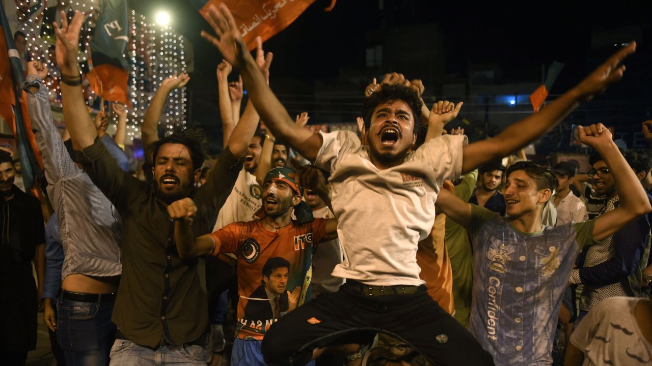 Supporters of Pakistan's cricketer-turned politician Imran Khan, head of the Pakistan Tehreek-e-Insaf (Movement for Justice) party, celebrate during general election in Lahore on July 25, 2018.