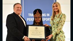 Secretary of State Mike Pompeo, joined by Advisor to the President Ivanka Trump, presents a certificate to 2018 'TIP Report Hero' Francisca Awah Mbuli of Cameroon. Francisca Awah Mbuli is one of ten individuals from around the world who was recognized for her efforts to fight against human trafficking, at the U.S. Department of State on June 28, 2018. 