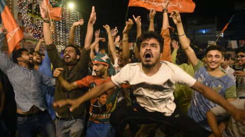 Khan's supporters celebrate Wednesday in the streets of Lahore.