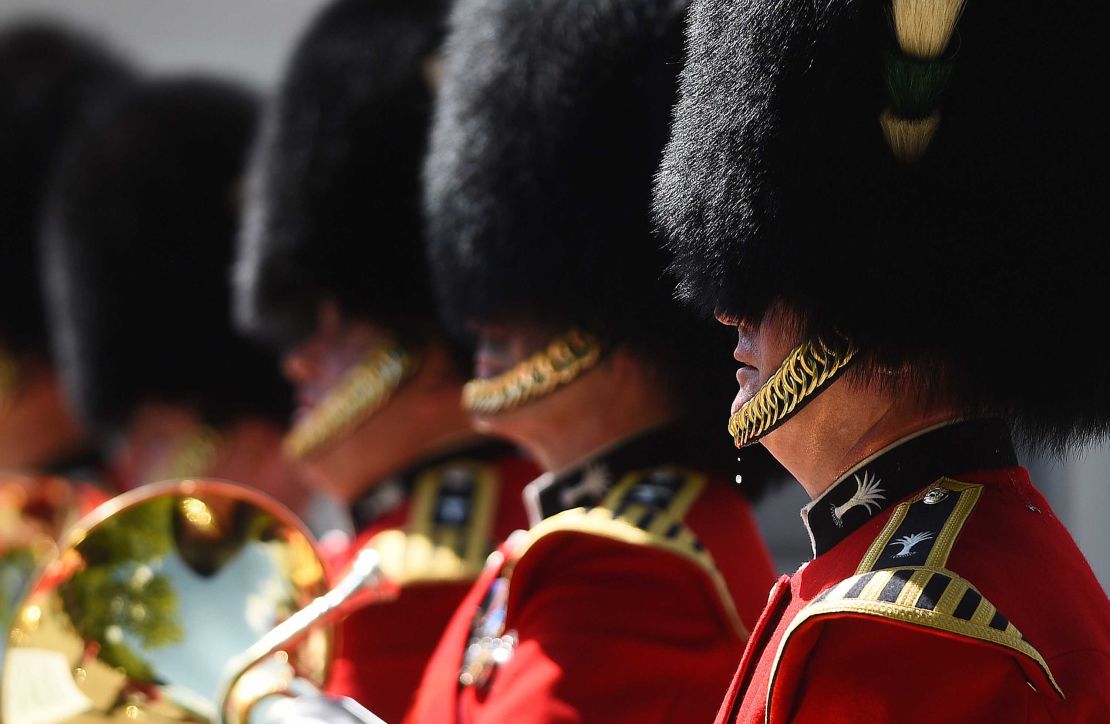A bead of sweat falls from a member of the Queen's Guard during the changing of the guard at Wellington Baracks in London.