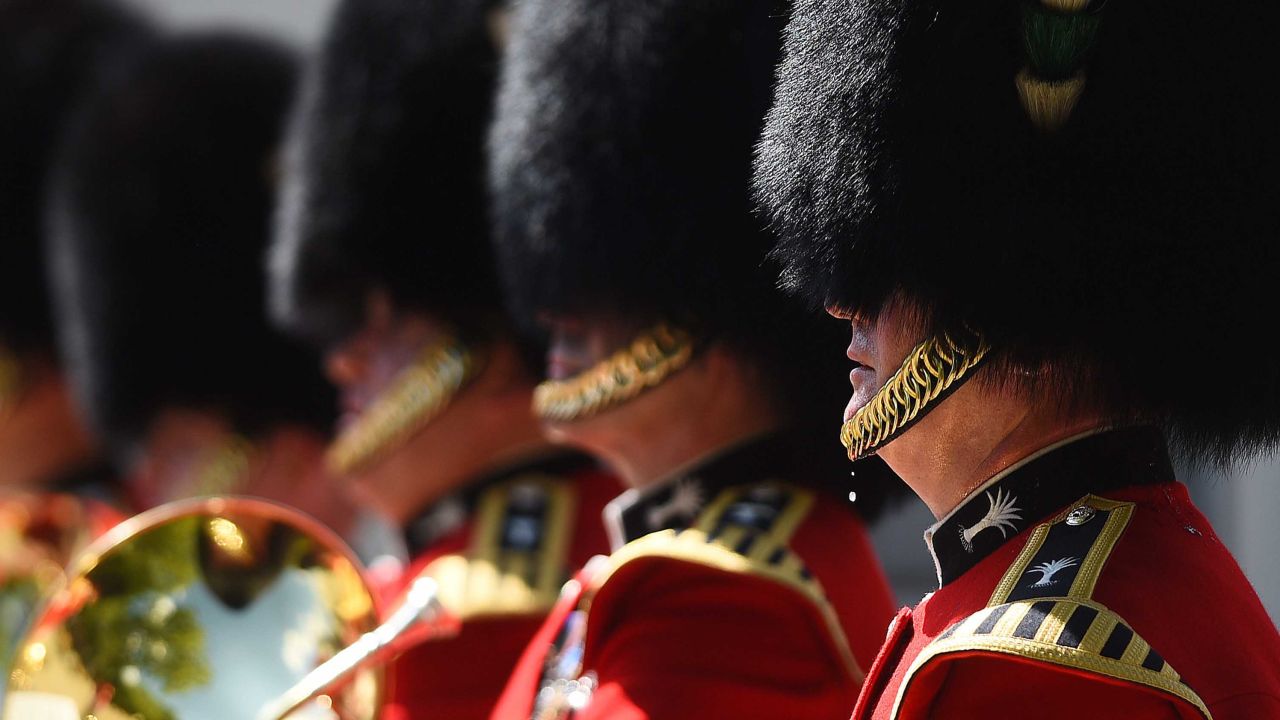 A bead of sweat falls from a member of the Queen's Guard during the changing of the guard at Wellington Baracks in London.