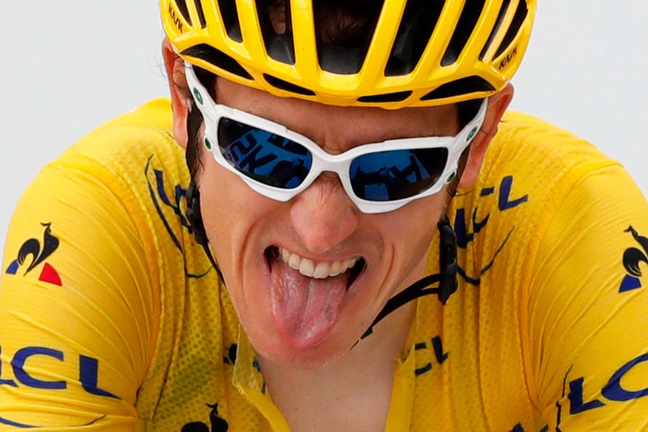 British cyclist Geraint Thomas grimaces as he crosses the finish line on July 25. He had been leading the Tour since the end of the 11th stage.